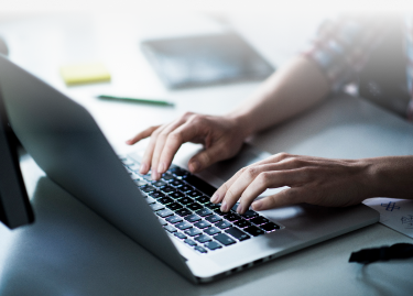 person typing on computer